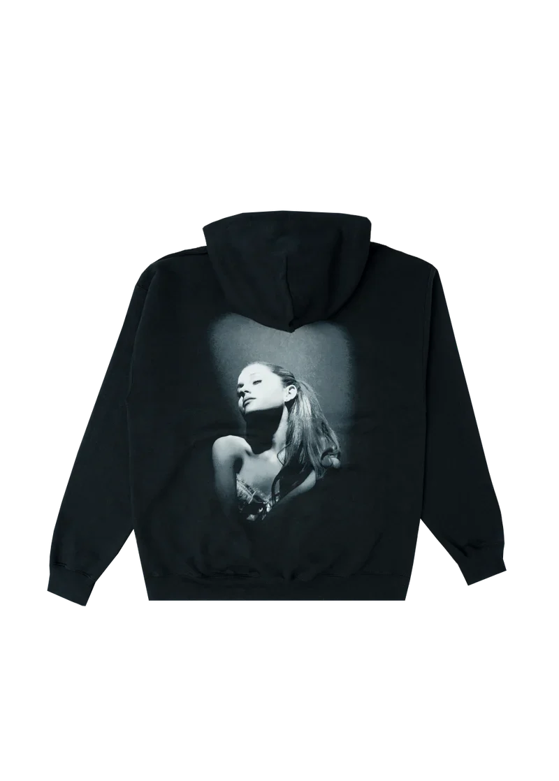 Back of black hoodie showcasing a large grayscale portrait of Ariana Grande from the Yours Truly album shoot. The spotlight effect and vintage tones give the hoodie a bold, timeless vibe.