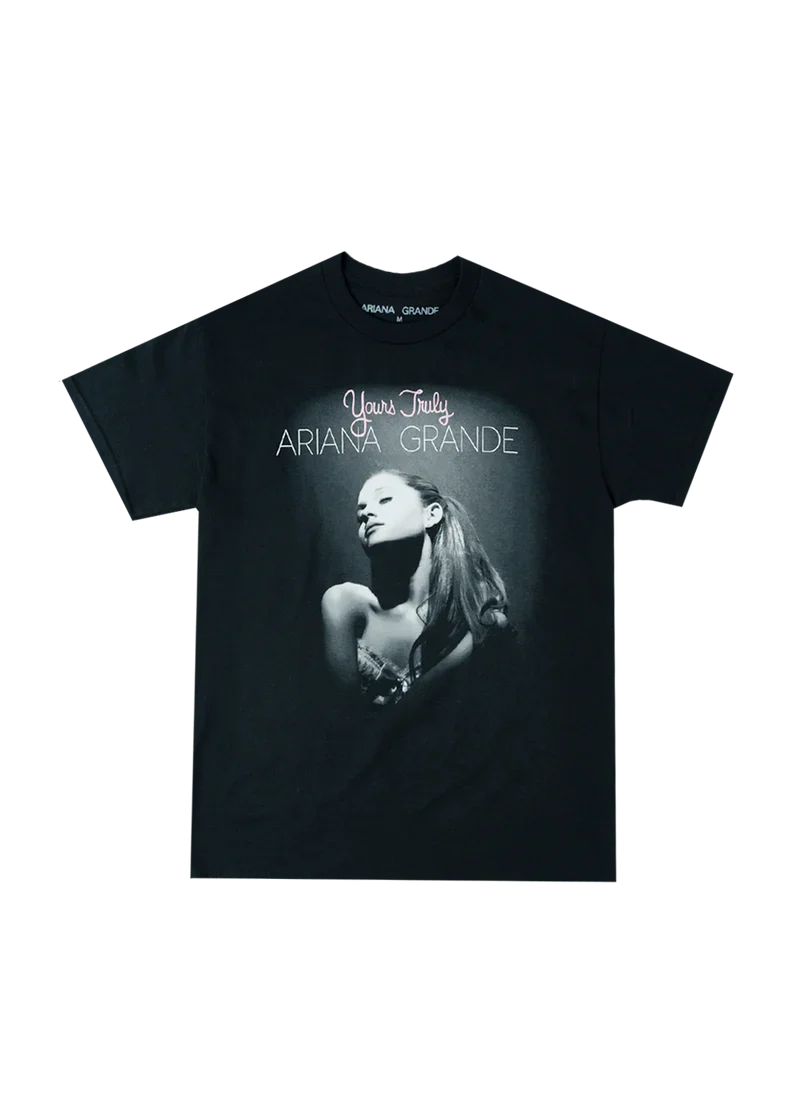 Black Ariana Grande t-shirt featuring the iconic Yours Truly album cover with a spotlighted black-and-white portrait of Ariana and pink-and-white text reading “Yours Truly Ariana Grande.”