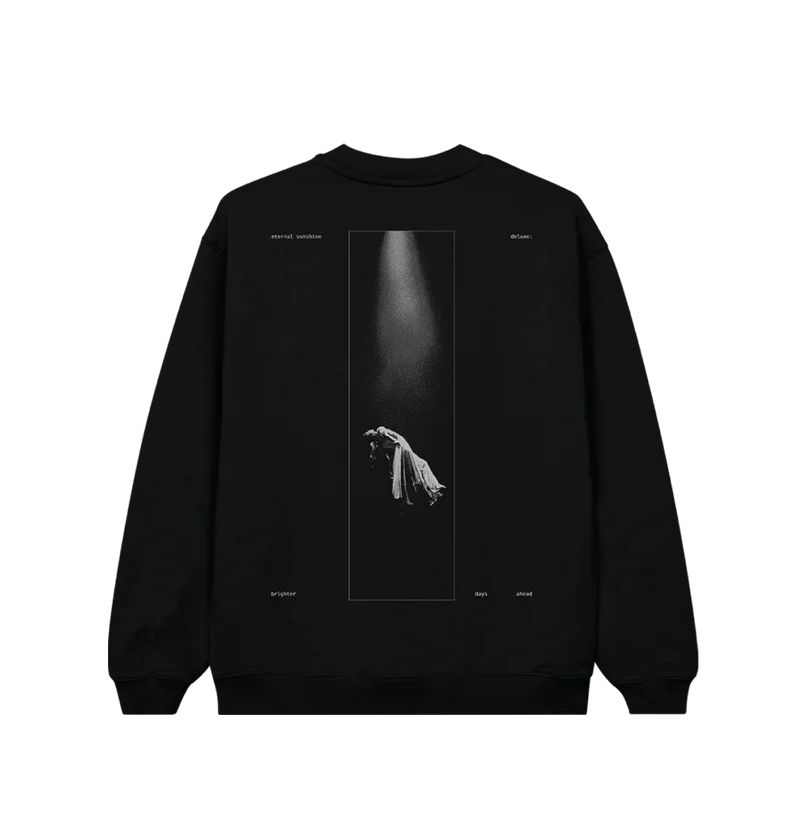 Back view of black Ariana Grande crewneck featuring a dramatic spotlight photo of a levitating figure in a long dress, surrounded by the words “eternal sunshine deluxe brighter days ahead.” A bold visual tribute to the Eternal Sunshine album aesthetic.