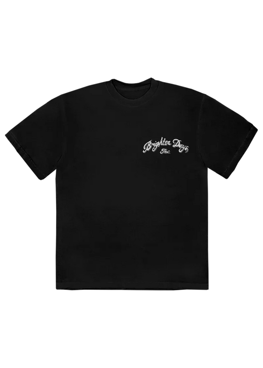 Black Ariana Grande t-shirt with a small vintage-style white script reading “Brighter Days Inc.” on the front left chest. A clean and classic look with a subtle nod to the Eternal Sunshine era.