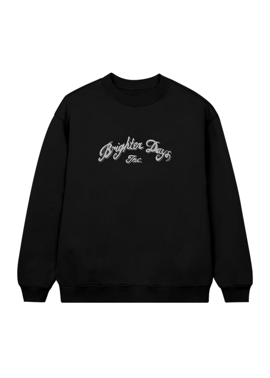 Black crewneck sweatshirt featuring elegant silver script that reads “Brighter Days Inc.” across the chest — minimalist yet vintage-inspired merch from Ariana Grande’s eternal sunshine collection.