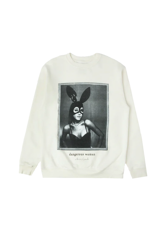 Cream-colored crewneck featuring a bold black-and-white photo of Ariana Grande in her iconic latex bunny mask and black bustier, with “dangerous woman” and her signature printed underneath — classic merch from the Dangerous Woman era.