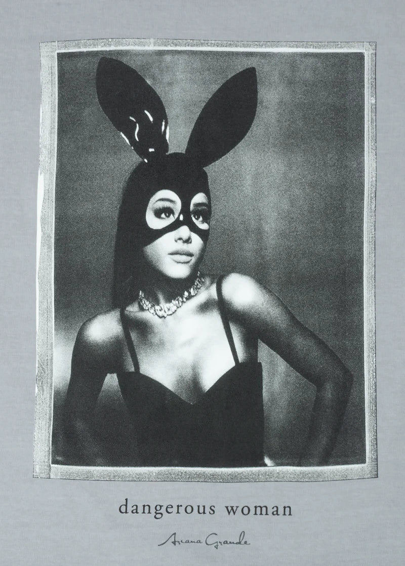 Close-up of the “dangerous woman” graphic on gray fabric, showing Ariana Grande in her bunny mask with fine print detail and signature text underneath.