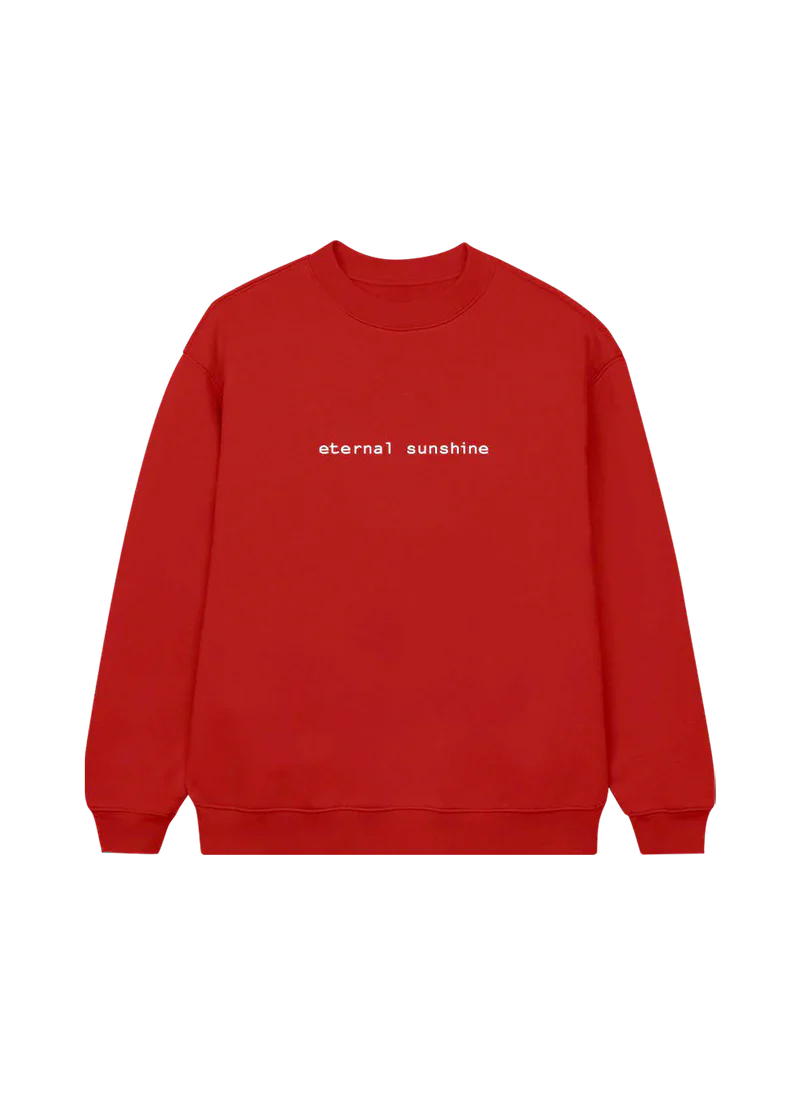 Bright red Ariana Grande crewneck sweatshirt featuring minimalist white text across the chest that reads “eternal sunshine.” Cozy and bold, this statement piece is inspired by Ariana’s Eternal Sunshine album aesthetic.