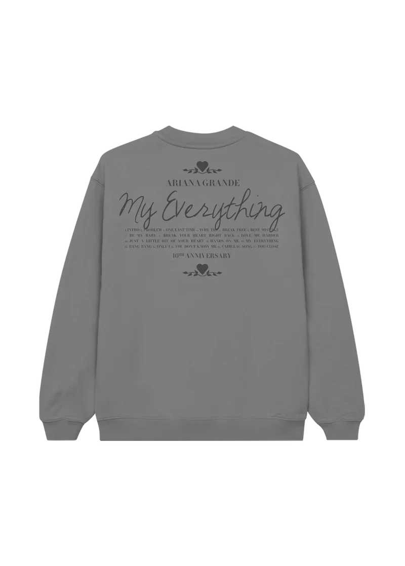 Back of grey crewneck with elegant black text reading "Ariana Grande My Everything" and a full tracklist underneath, celebrating the 10th anniversary of the iconic album.
