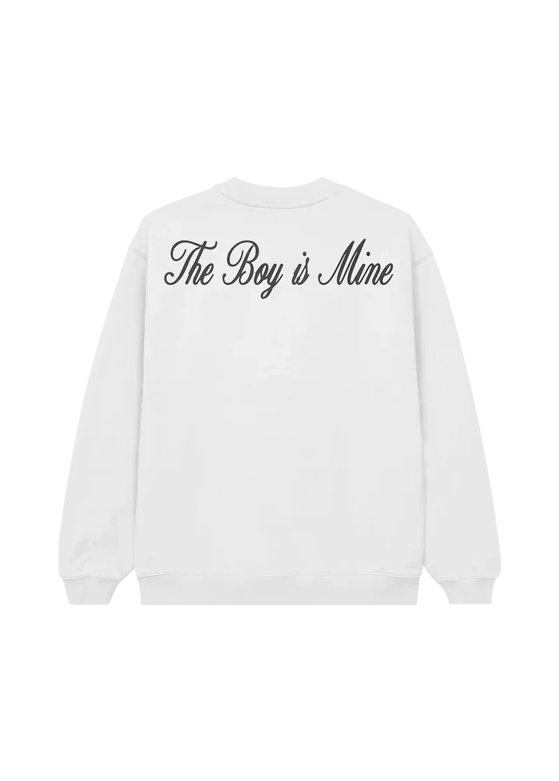 Back of white crewneck with elegant black cursive text reading “The Boy is Mine” across the shoulders — sleek fanwear nodding to Ariana Grande’s fierce single.