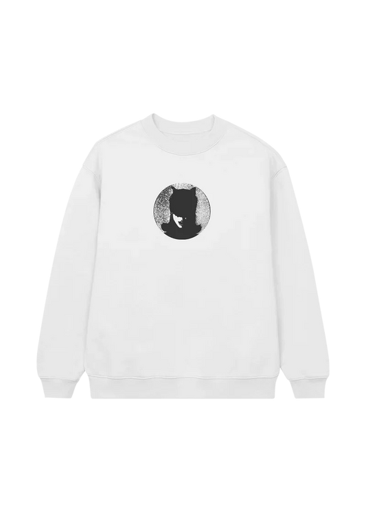 White crewneck sweatshirt with a centered black circular graphic of Ariana Grande in a cat mask, silhouetted against a textured gray background — minimal yet bold design inspired by the boy is mine.