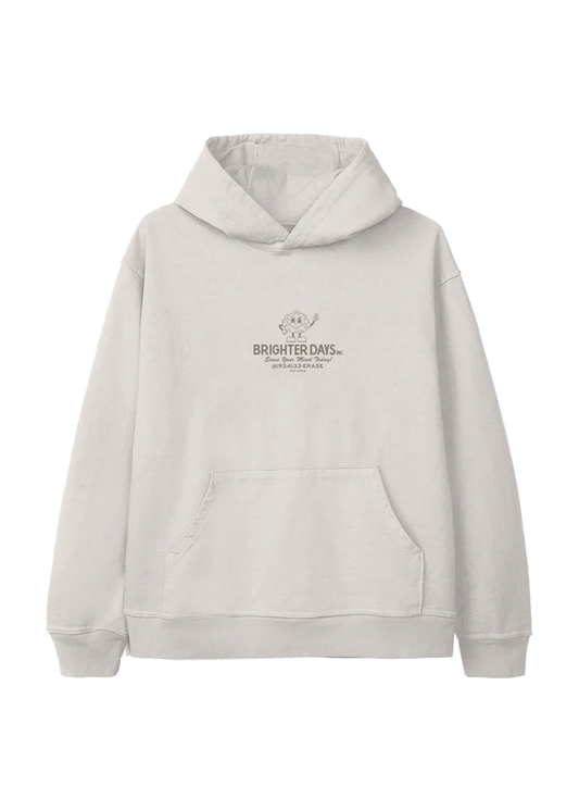Off-white hoodie with a small retro cartoon flower mascot above the text "Brighter Days Inc." and the phrase "Erase Your Mind Today!" followed by a phone number, "(934) 33-ERASE" — playful, nostalgic merch from Ariana Grande’s eternal sunshine collection.

