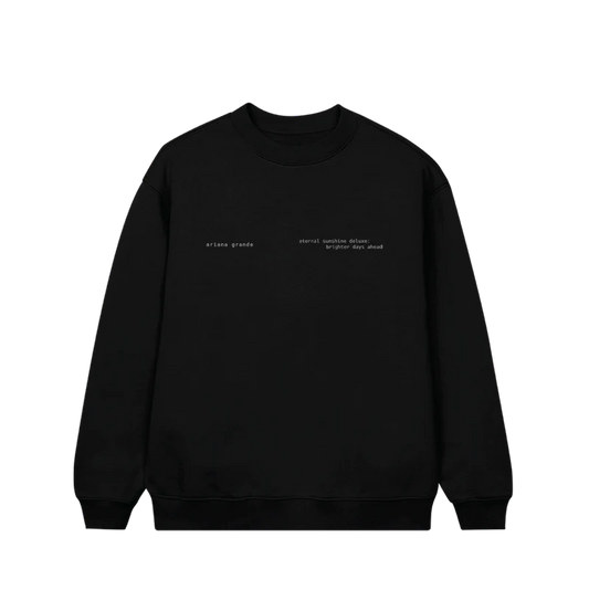 Black Ariana Grande crewneck sweatshirt featuring minimalist white text on the front left chest that reads “ariana grande” and “eternal sunshine deluxe: brighter days ahead.” A subtle and sleek design perfect for fans of the Eternal Sunshine era.

