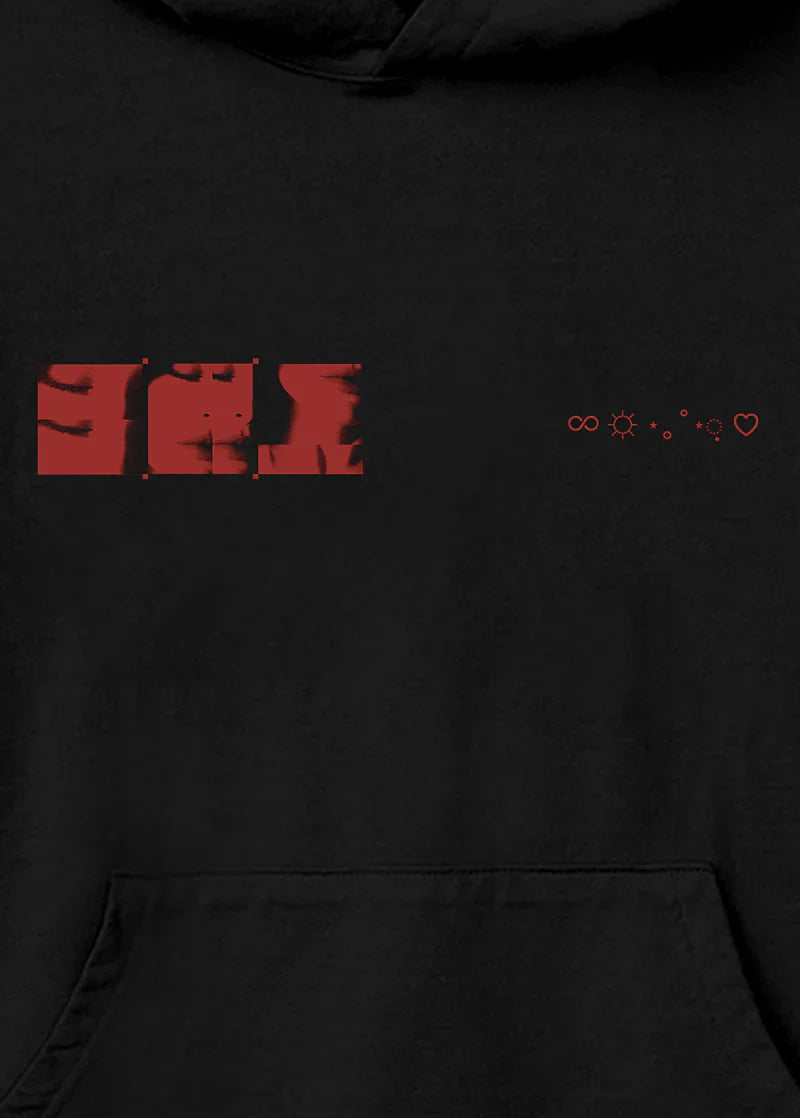 Zoomed-in view of the red Eternal Sunshine chest graphic showing stylized photo segments of Ariana Grande's face alongside infinity, sun, and heart icons.