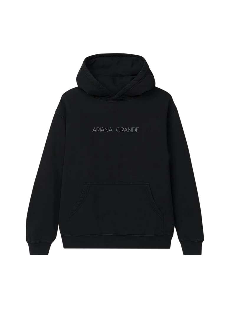 Black Ariana Grande hoodie with minimalist 'ARIANA GRANDE' text printed in thin, spaced-out lettering across the chest. A sleek and simple design perfect for fans of the Yours Truly era.
