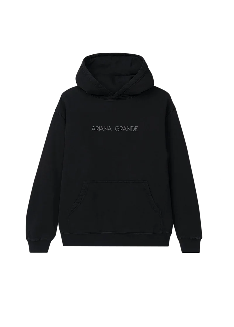 Black Ariana Grande hoodie with minimalist 'ARIANA GRANDE' text printed in thin, spaced-out lettering across the chest. A sleek and simple design perfect for fans of the Yours Truly era.