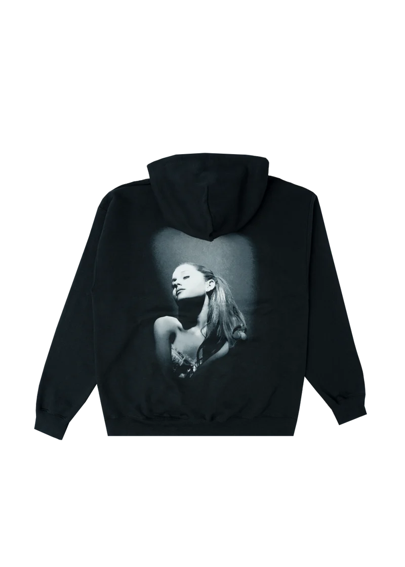 Back of black hoodie showcasing a large grayscale portrait of Ariana Grande from the Yours Truly album shoot. The spotlight effect and vintage tones give the hoodie a bold, timeless vibe.