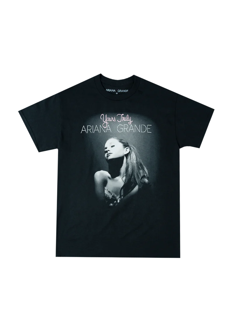 Black Ariana Grande t-shirt featuring the iconic Yours Truly album cover with a spotlighted black-and-white portrait of Ariana and pink-and-white text reading “Yours Truly Ariana Grande.”

