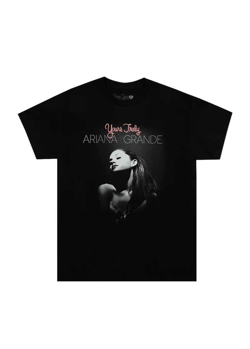 Black Ariana Grande t-shirt with a puff print design featuring a grayscale portrait of Ariana and the text 'Yours Truly Ariana Grande' above the image. A bold tribute to her debut album's 10th anniversary.