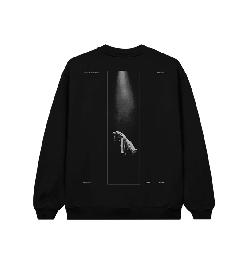 Back view of black Ariana Grande crewneck featuring a dramatic spotlight photo of a levitating figure in a long dress, surrounded by the words “eternal sunshine deluxe brighter days ahead.” A bold visual tribute to the Eternal Sunshine album aesthetic.

