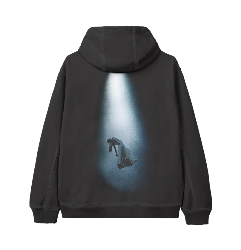Back of black hoodie showcasing a dramatic image of Ariana Grande levitating under a spotlight in a flowing gown — visually powerful merch from the brighter days ahead visual theme.

