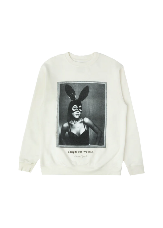 Cream-colored crewneck featuring a bold black-and-white photo of Ariana Grande in her iconic latex bunny mask and black bustier, with “dangerous woman” and her signature printed underneath — classic merch from the Dangerous Woman era.

