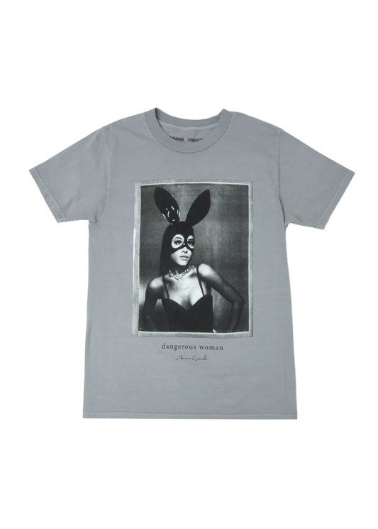 Gray unisex t-shirt featuring a bold black-and-white portrait of Ariana Grande in her signature latex bunny mask and bustier, with “dangerous woman” and her signature printed below — iconic look from her Dangerous Woman album.

