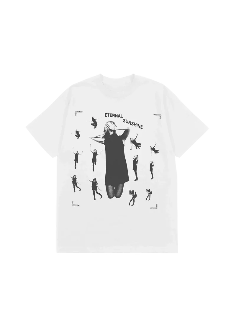 White Ariana Grande t-shirt featuring a collage of black-and-white silhouettes of Ariana in various poses surrounding a central image of her with hands over her eyes. "ETERNAL SUNSHINE" arches across the chest, capturing the ethereal vibe of the album’s visual theme.


