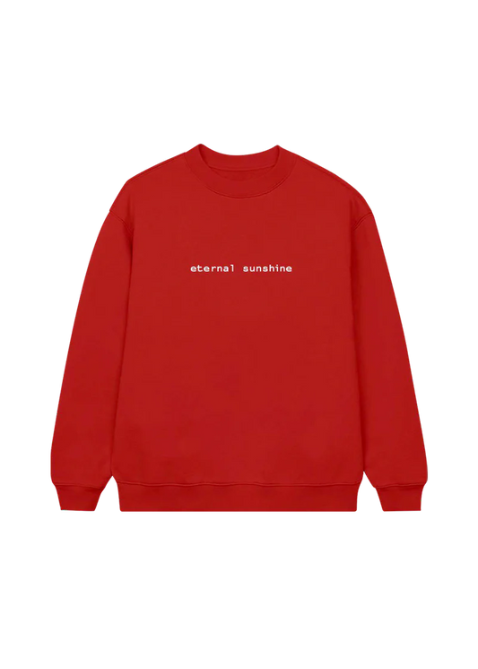 Bright red Ariana Grande crewneck sweatshirt featuring minimalist white text across the chest that reads “eternal sunshine.” Cozy and bold, this statement piece is inspired by Ariana’s Eternal Sunshine album aesthetic.

