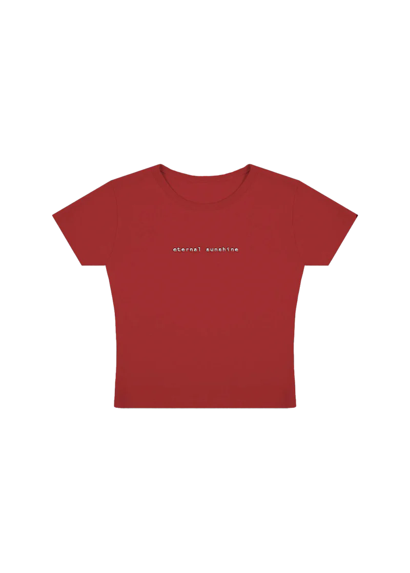 Fitted red cropped t-shirt with minimalist lowercase white text reading “eternal sunshine” across the chest — sleek and simple design inspired by Ariana Grande’s eternal sunshine album aesthetic.

