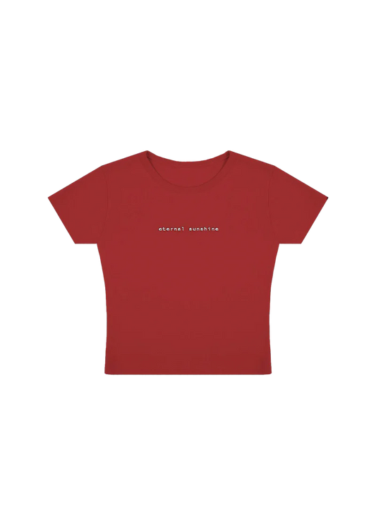 Fitted red cropped t-shirt with minimalist lowercase white text reading “eternal sunshine” across the chest — sleek and simple design inspired by Ariana Grande’s eternal sunshine album aesthetic.

