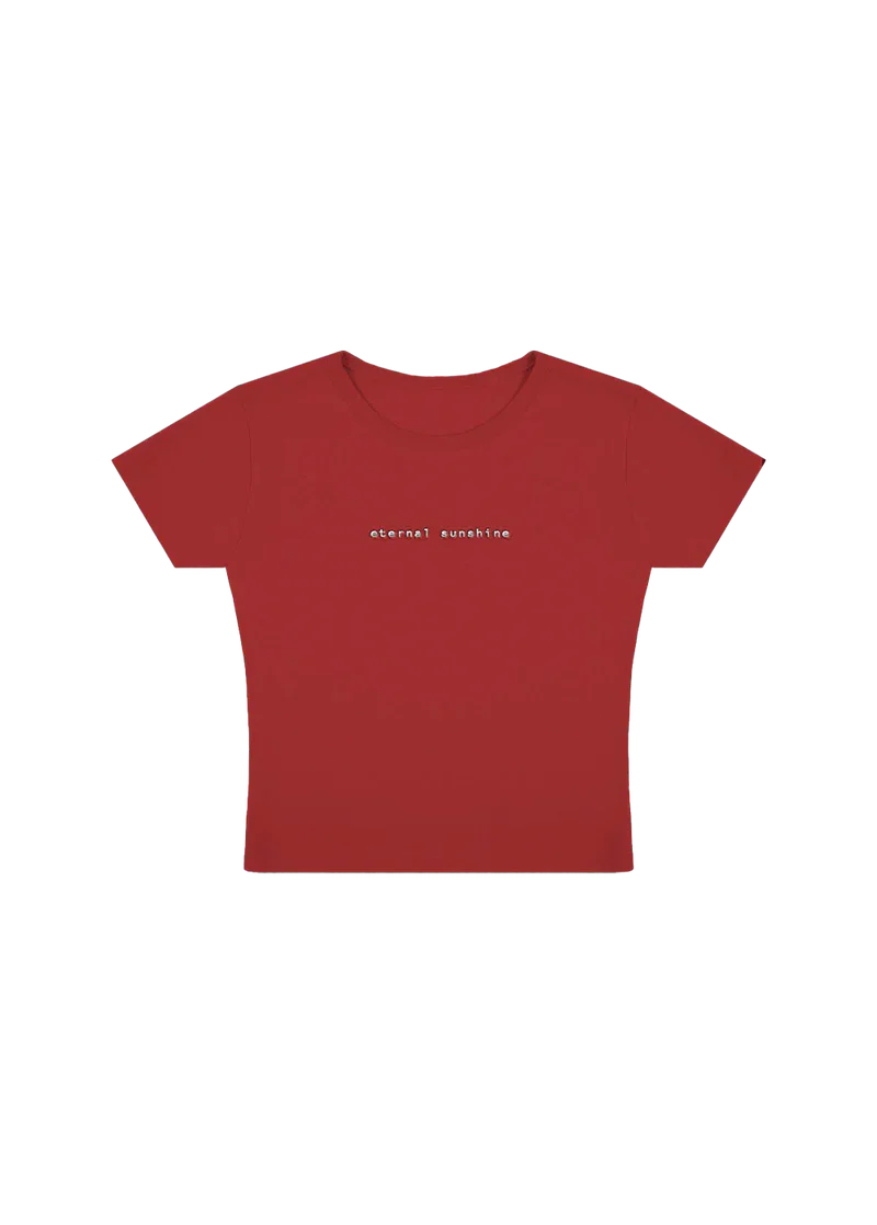 Fitted red cropped t-shirt with minimalist lowercase white text reading “eternal sunshine” across the chest — sleek and simple design inspired by Ariana Grande’s eternal sunshine album aesthetic.

