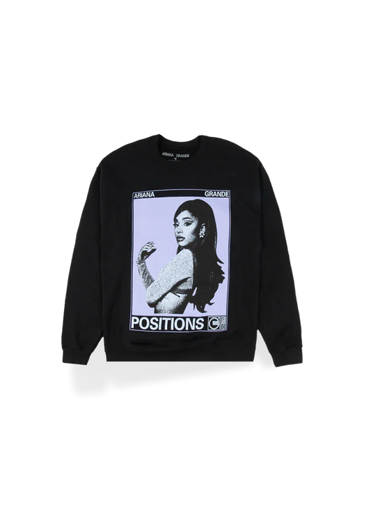 Black Ariana Grande crewneck sweatshirt featuring a large graphic of Ariana in a vintage photo booth style with bold white text reading “POSITIONS.” A striking pop art–inspired design that captures the aesthetic of her Positions era.

