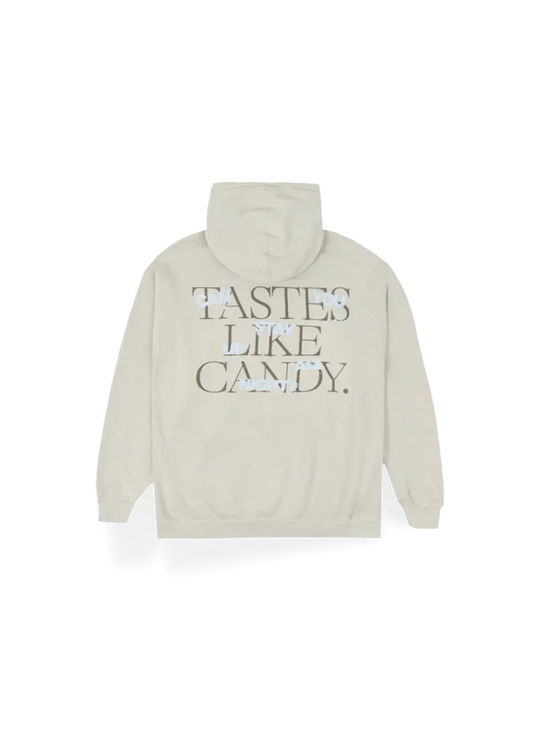 Cream-colored Ariana Grande hoodie with bold block text on the back reading “TASTES LIKE CANDY.” referencing her hit 34+35. Soft and cozy, this hoodie makes a sweet statement for fans of the Positions era.


